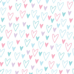 Simple seamless pattern with pink, blue and purple hand drawn hearts on white background. For children's room, wallpaper, textile, gift paper, notebook cover