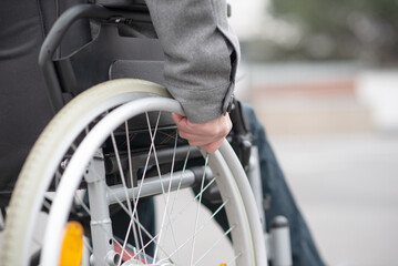 Fototapeta premium a hand on a wheelchair