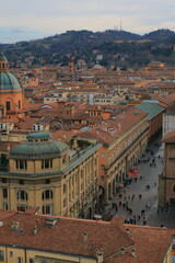 Obraz premium Top view of the historic center of the Italian city of Bologna on a cloudy day. The Bolognese hills are in the background.