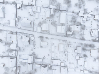 Snow-covered houses. Country village. Top view