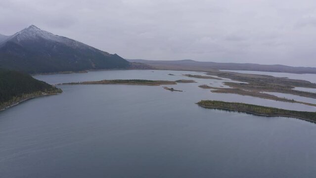 Aerial drone footage of Borovoe and Great Chebachye Lakes in Natonal park Burabay, Kazakhstan. The Blue Mountain - Kokshe Tau in winter landscape.