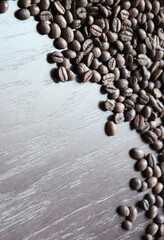 Coffee grains on a wooden table
