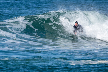 Bodyboarder surfing ocean wave