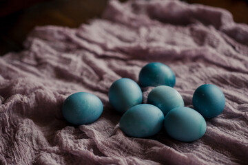 blue easter eggs on a wooden table