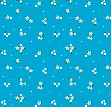 Cute floral pattern in the small flower. Seamless vector texture. Elegant template for fashion prints. Printing with small ivory white flowers. Vintage blue background. Simple flat modern drawing.