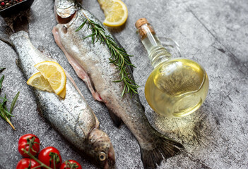 raw trout with spices on stone background with copy space for your text