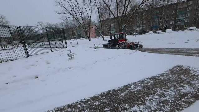 FPV shooting of snow removal equipment, snow removal machine operation, snow removal equipment, mtz tractor removes snow