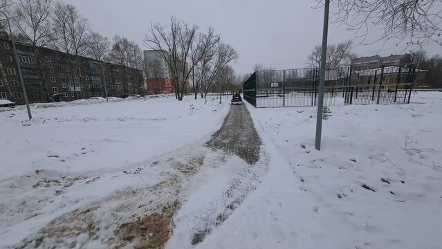 FPV shooting of snow removal equipment, snow removal machine operation, snow removal equipment, mtz tractor removes snow