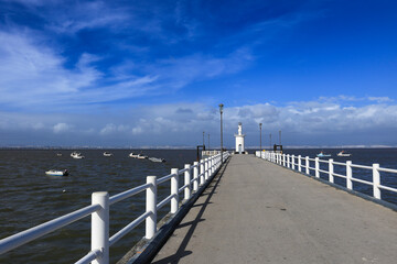 Lighthouse at the end of a jetty in Alcochete town