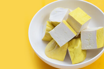 Yellow tofu on yellow background.