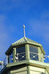 Lighthouse lantern room with blue sky background