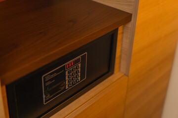 a safe in a hotel room a small storage room for personal belongings Theft or keeping valuables
