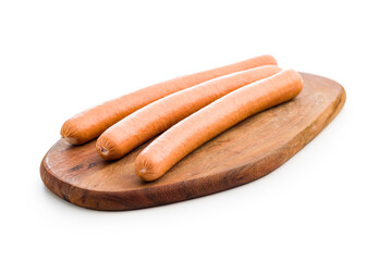 Tasty sausages. Frankfurterson cutting board  isolated on white background.