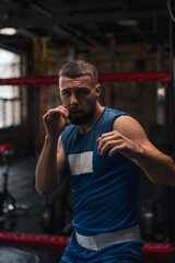 Obraz premium Close-up portrait of a boy boxer fighting with a shadow