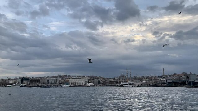 Timelapse view of Istanbul cityscape with tourist ships floating at Bosphorus