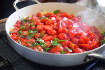 tomatoes cooking in a pan