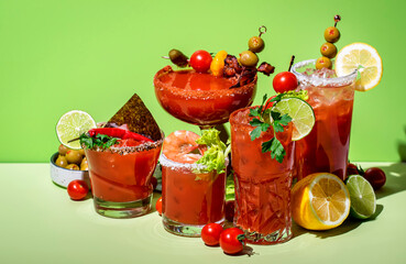 Bloody Mary, Joseph, Caesar and other red cocktails set with tomato juice, vodka, hot sauce and celery. Cocktail party. Green background, hard light - obrazy, fototapety, plakaty