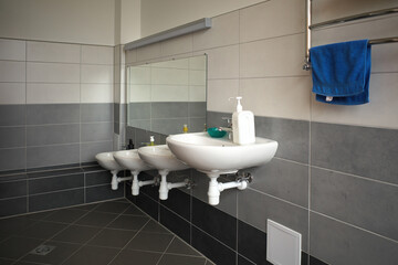 kindergarten children's bathrooms. The sinks are installed at different heights. Children's hygiene...