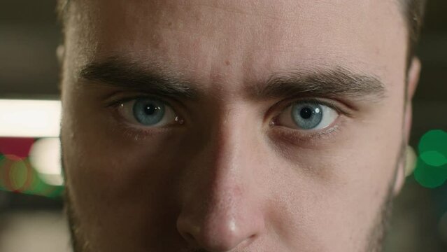 Close up male eyes strong sight angry unrecognizable man staring look at camera looking focused healthy eyesight ophthalmology clear eye vision blue eyeballs Caucasian guy face in details macro view