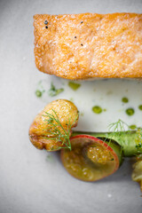 fine dining dinner with fish and vegetables