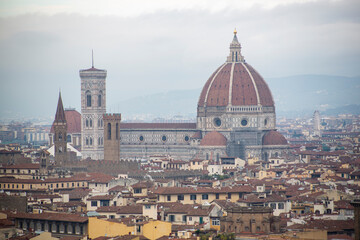 Fototapeta na wymiar Top view of the Cathedral Santa Maria del Fiore, which is the Duomo of Florence in the middle of the city in Italy