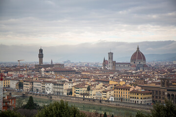 Fototapeta na wymiar Top view of the entire city of Florence including the Cathedral Santa Maria del Fiore, which is the Duomo of Florence in the middle of the city in Italy