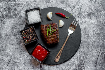 grilled beef steak on stone background 