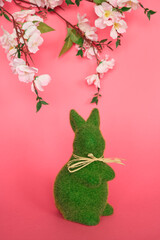 Hop into Easter with a Grass Bunny on a Pink Background Easter Joy with a Pink Bunny Hopping through the Green Grass Hippity-Hoppity! Easter Fun with a Cute Grass Bunny on a Pink Pastel Background