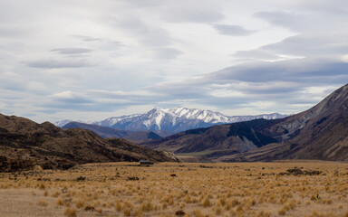 Castle Hill Peak. Canterbury, New Zealand.

A barren landscape looking toward the snow topped Castle Hill Peak on a cold winters day in Christchurch, New Zealand.