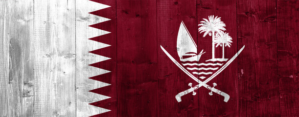 Flag of Qatar on a textured background. Concept collage.