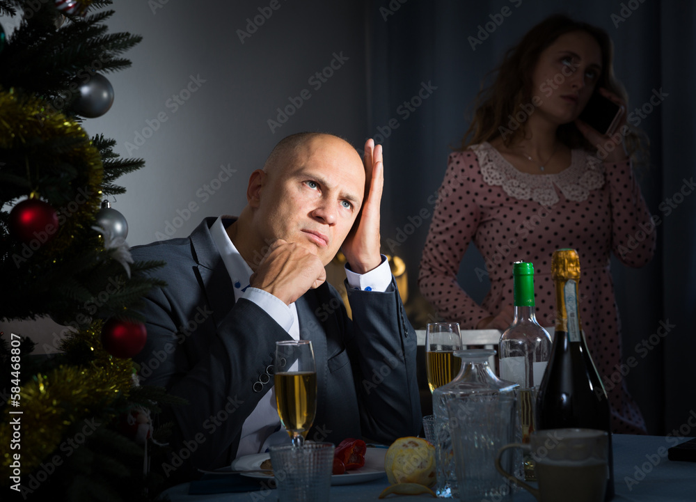 Wall mural portrait of couple offended after quarrel during christmas dinner