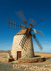 Beautiful image of a historic traditional Canarian windmill in Fuerteventura  Canary Islands Spain