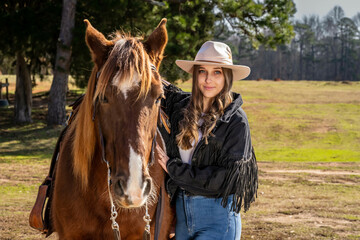 Lovely Brunette Cowgirl Enjoying A Day With Her Horse On Her Farm