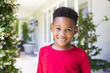 Portrait of happy african american boy looking at camera and smiling