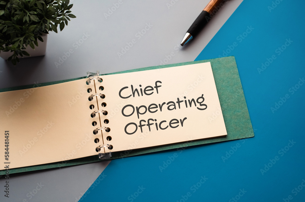 Poster there is a notebook with the word chief operating officer. it is eye-catching image.