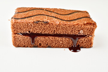 Chocolate pastry with syrup isolated on white background with clipping path