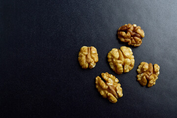 Top view of walnut without shell on dark background