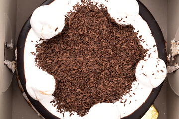 Chocolate shavings on top of the cake in box