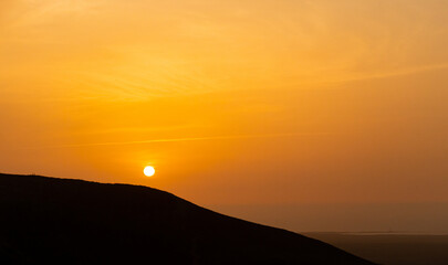 Obraz premium Beautiful and dramatic sunset colours over the volcanic mountain range near Corralejo in Fuerteventura Canary Islands Spain