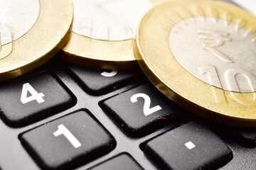 Closeup of Indian coins with calculator, indian money concept