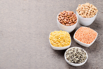 Variety of raw dal in bowl, kidney beans red gram, chana and black split gram