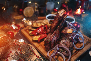 grilled barbecue meat ribs, veal, beef, lamb rack with vegetables, christmas bbq