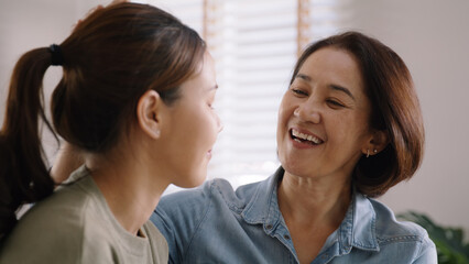 Middle aged asia people old mom love care trust comfort help young teen talk crying stress relief at home. Mum as friend listen adult child woman feel pain sad worry of broken heart life crisis issues