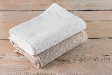 Fototapeta na wymiar Folded soft towels on wooden table