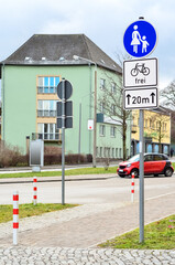Road signs for pedestrians and cyclists on city street
