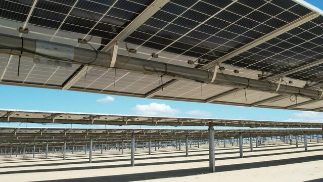 View of solar panels with bifacial technology and tracker from drone never before seen footage with gimbal extender range