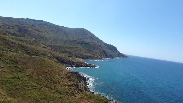 aerial shot by drone of the mountains of bejaia which overlooks the sea