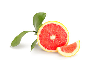 Half of ripe grapefruit and plant branch on white background