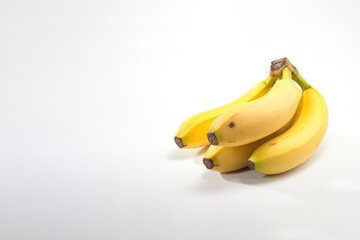 Ripe bananas bunch isolated on white background with copy space. Created with Generative AI Technology