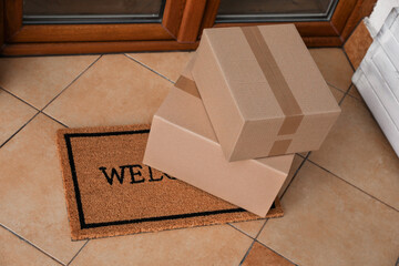 Parcels delivered on mat near front door